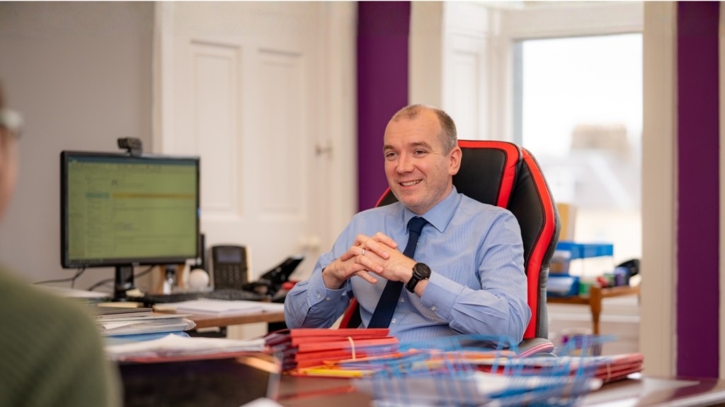 Tim at Desk paperwork