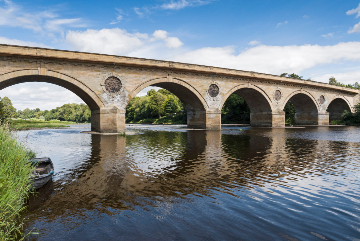 The 18th century Coldstream Bridge by engineer John Smeaton links Coldstream in Scotland with Cornhill-on -Tweed in Northumberland, England, UK.
