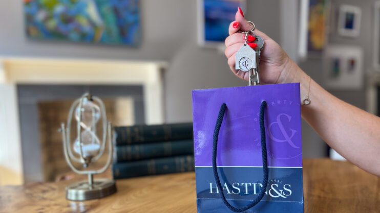 Hastings Legal branding – house keys and bag representing property and legal services.
